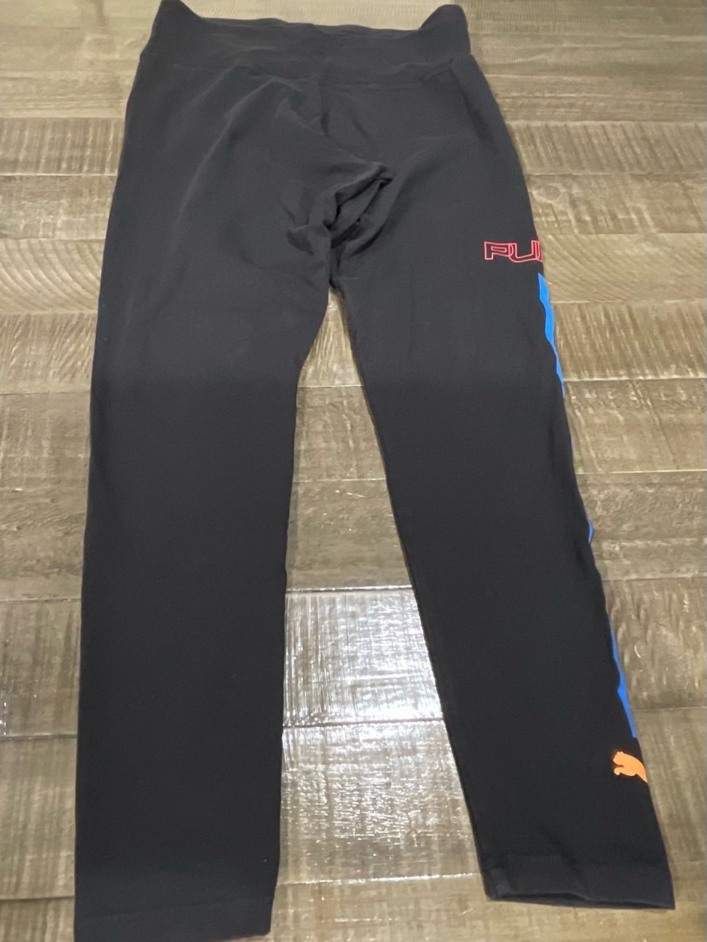Puma Black Leggings with Blue Side Stripe and Orange Puma Cat Accent